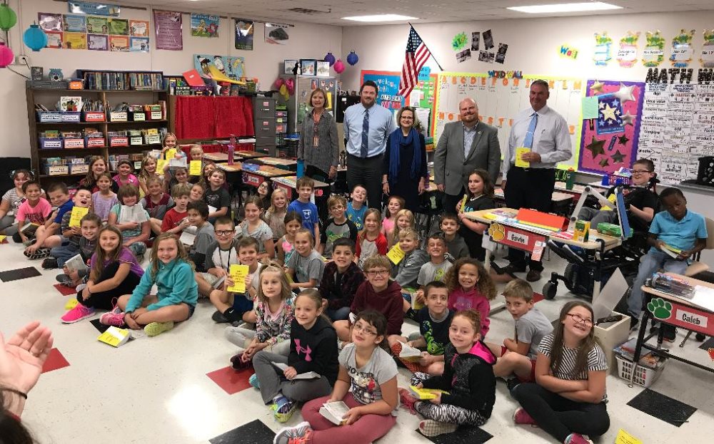 Excited students receive their dictionaries